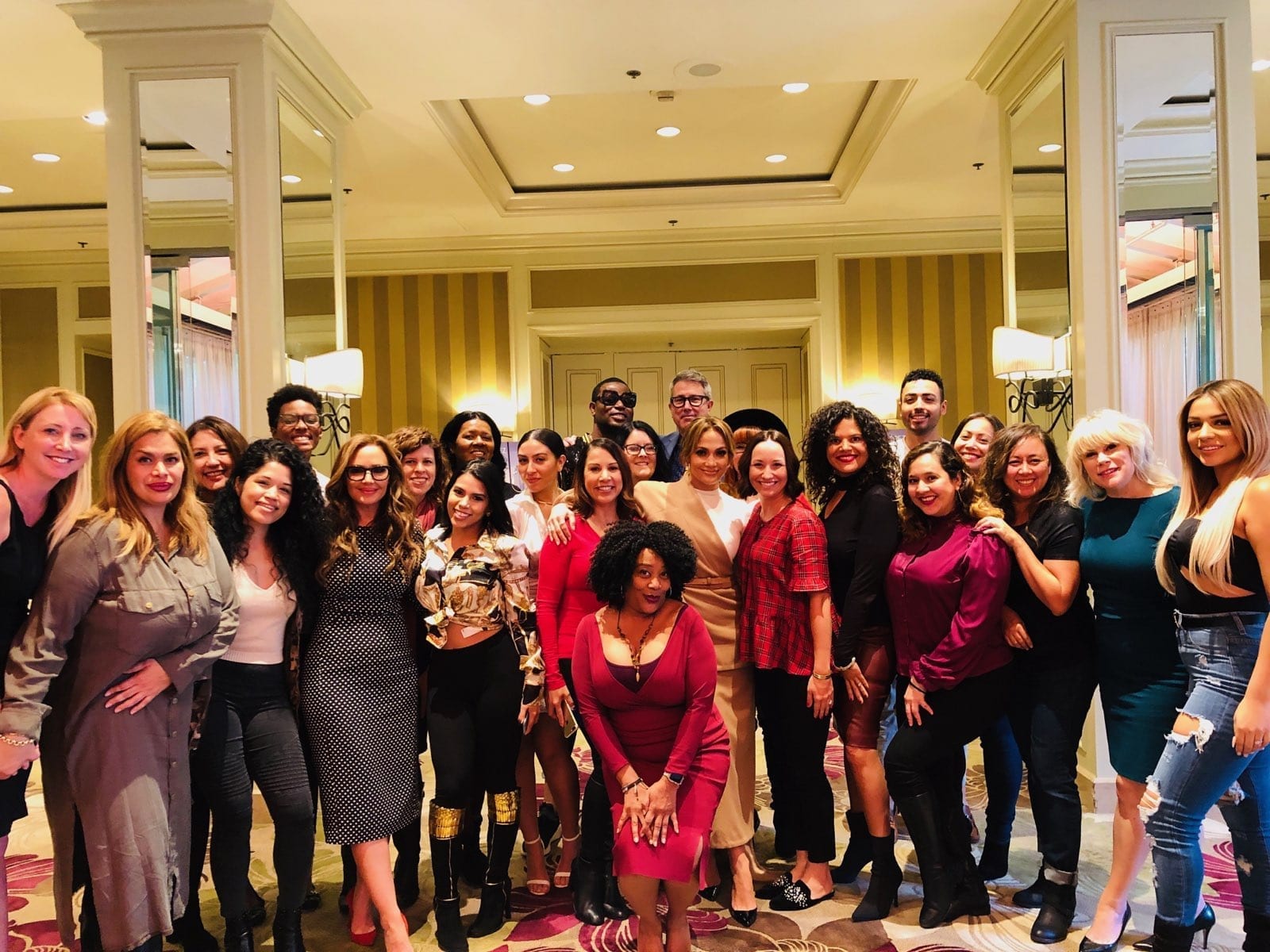 Jennifer Lopez with arm around Michelle Rivera of Michelle Rivera Lifestyle at Press Junket. Leah Remini in front far left side.